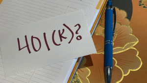 Notebook, pen and note about 401k